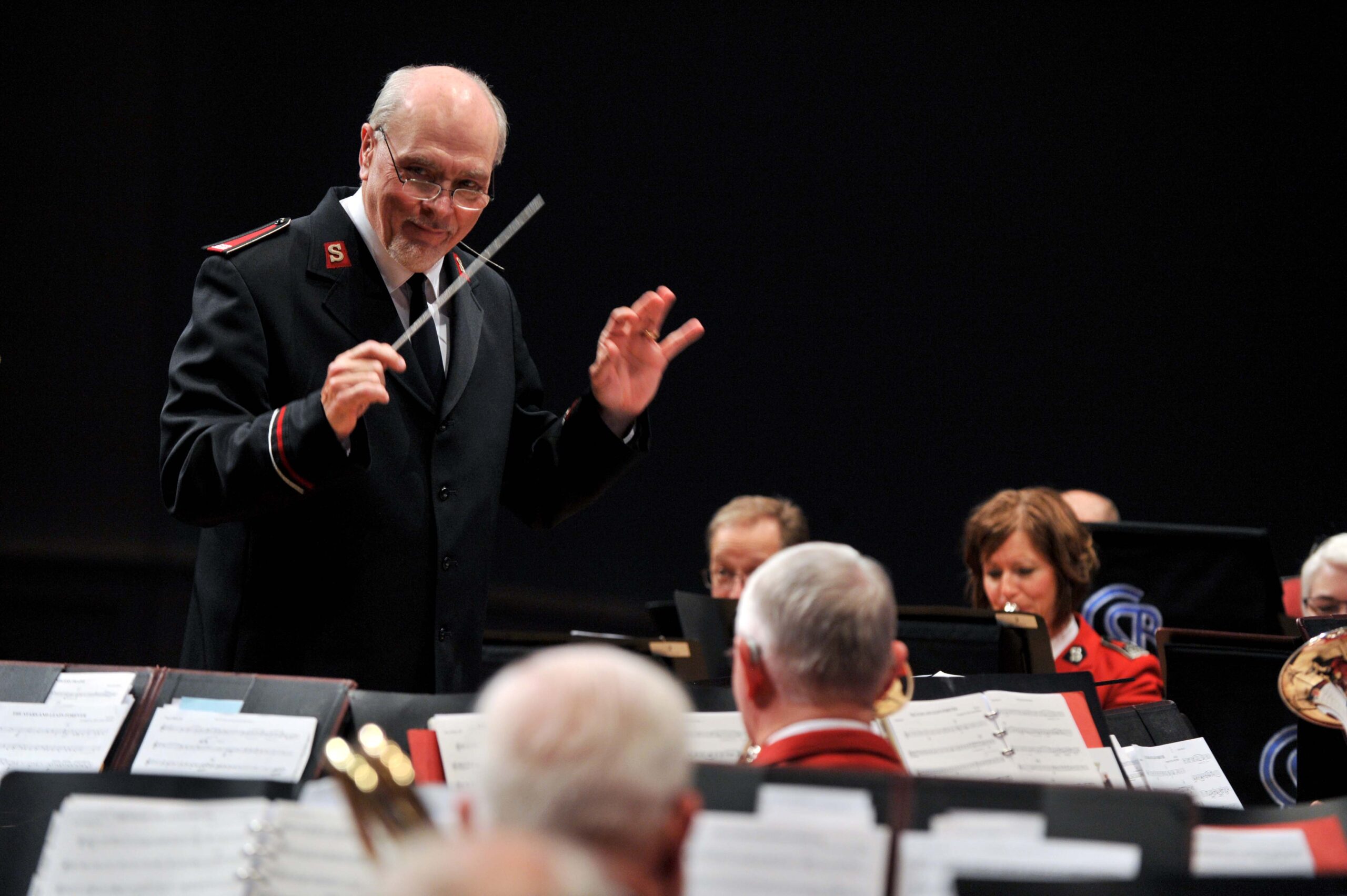 Bandmaster Bill Himes leads a brass band