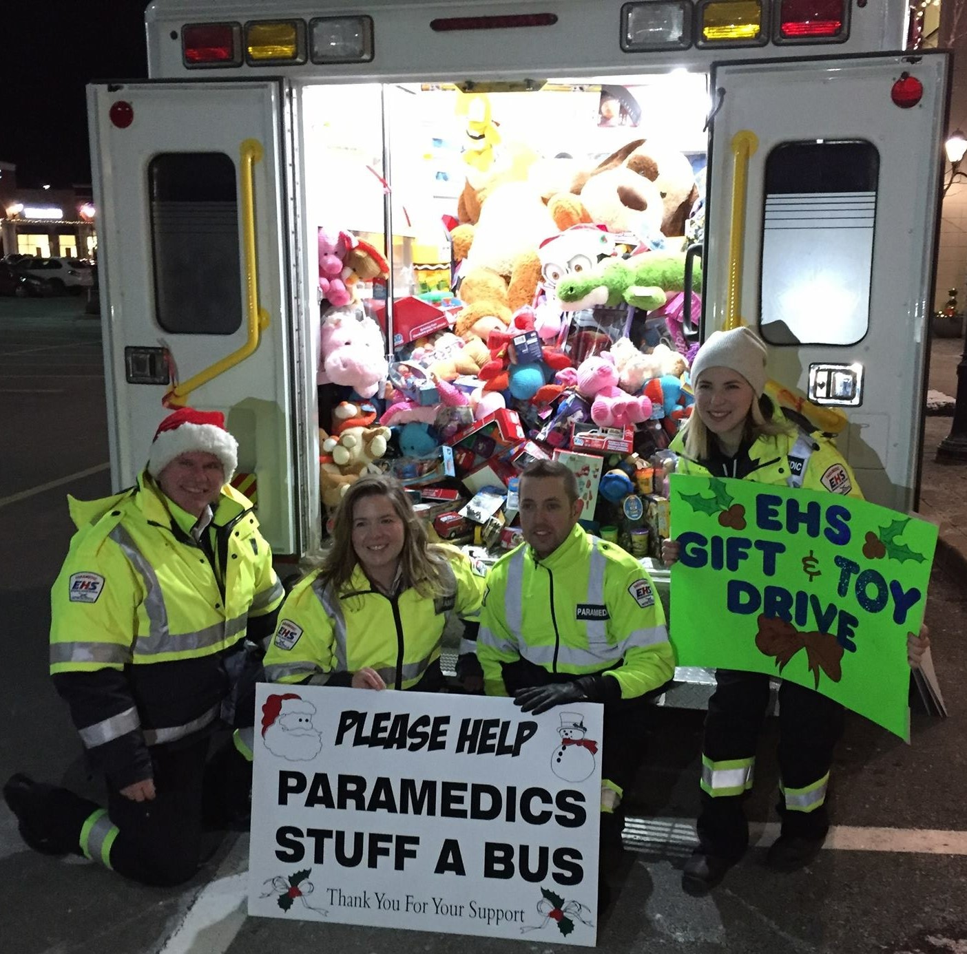 Emergency responders collect toys for kids at Christmas with their truck