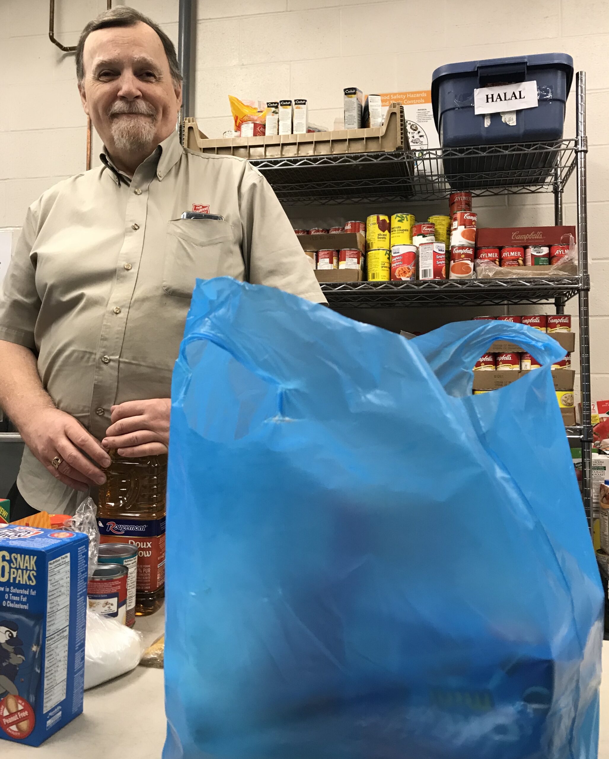 Man sorts food at the Centre of Hope in Halifax