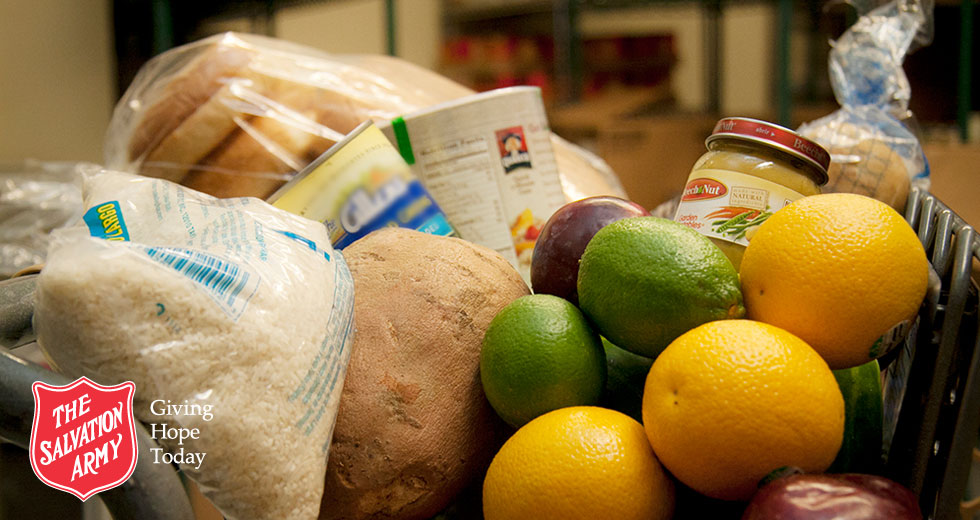 food pantry items that include rice, fruit, bread and potatoes