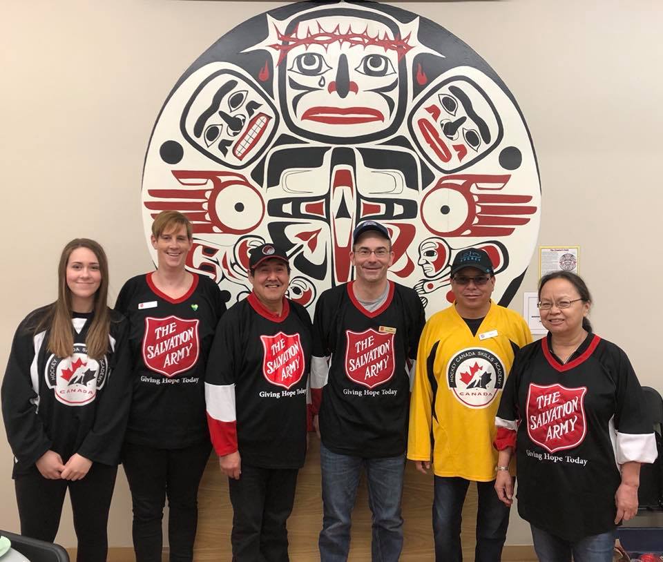 Group of people in Salvation Army Hockey jerseys