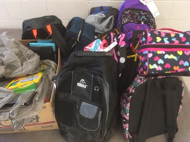 Several backpacks in a pile