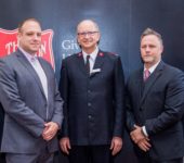 Three men posing for photo