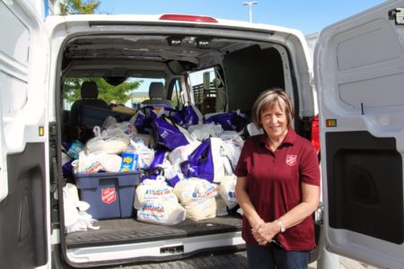 Caroline Kitney with food donations for Thanksgiving