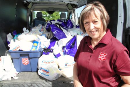 Caroline Kitney with food donations for Thanksgiving
