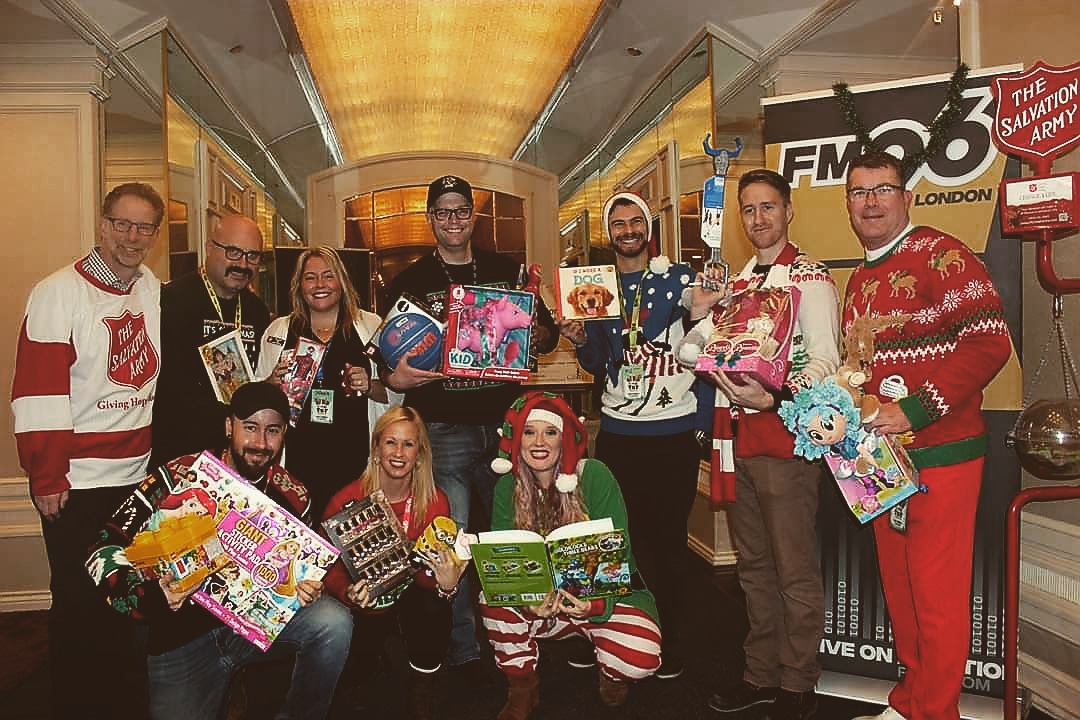 Salvation army employees holding toys