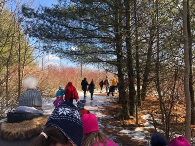 A photo of campers from The Salvation Army Oshawa Temple walking through a nature trail.