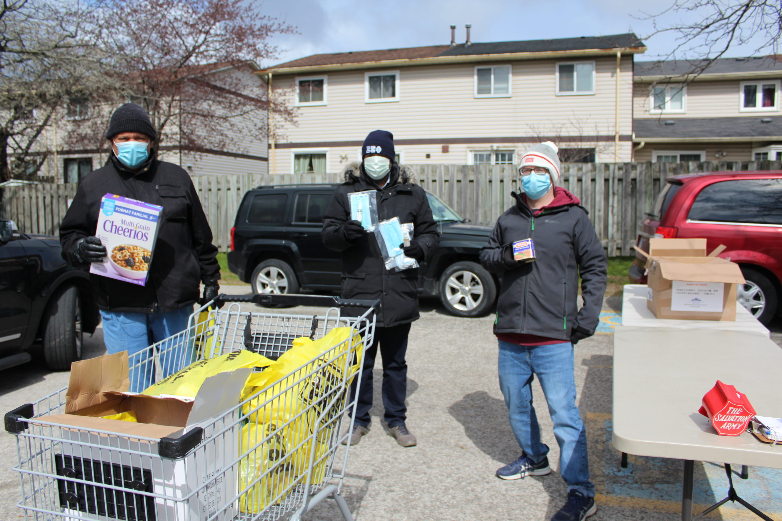 Local councillor and Salvation Army officers at Agincourt Community Church food drive.