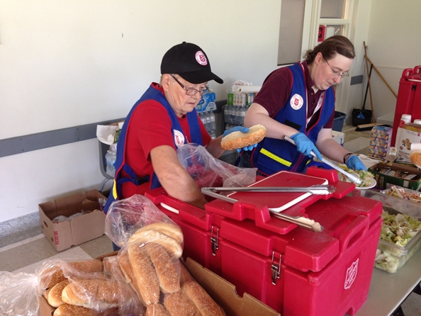 Volunteers work hard at food preparation for first responders and victims of outplacement.