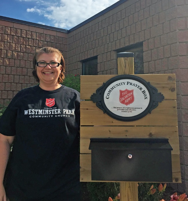 Captain Tracy Savage stands by the Community Prayer Box outside the Westminster Park Community Church in London