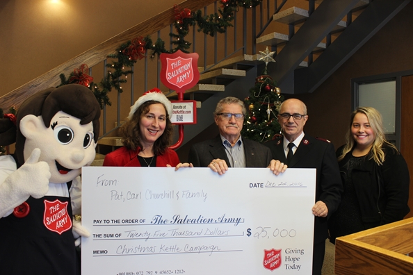 Carl Churchill presents a $25,000 donation to the London Christmas Kettle Campaign, Shown from let to right, Salvation Army Mascot Sally Ann, 2016 Kettle Champion Anne Marie Decicco-Best, Carl Churchill, Divisional Commander Everett Barrow, and London Media Relations Representative Shannon Wise.