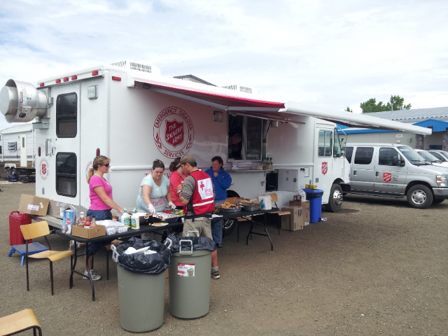 EDS workers serving food to people