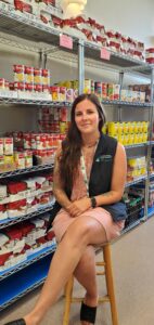 a mental health worker sitting in a food bank