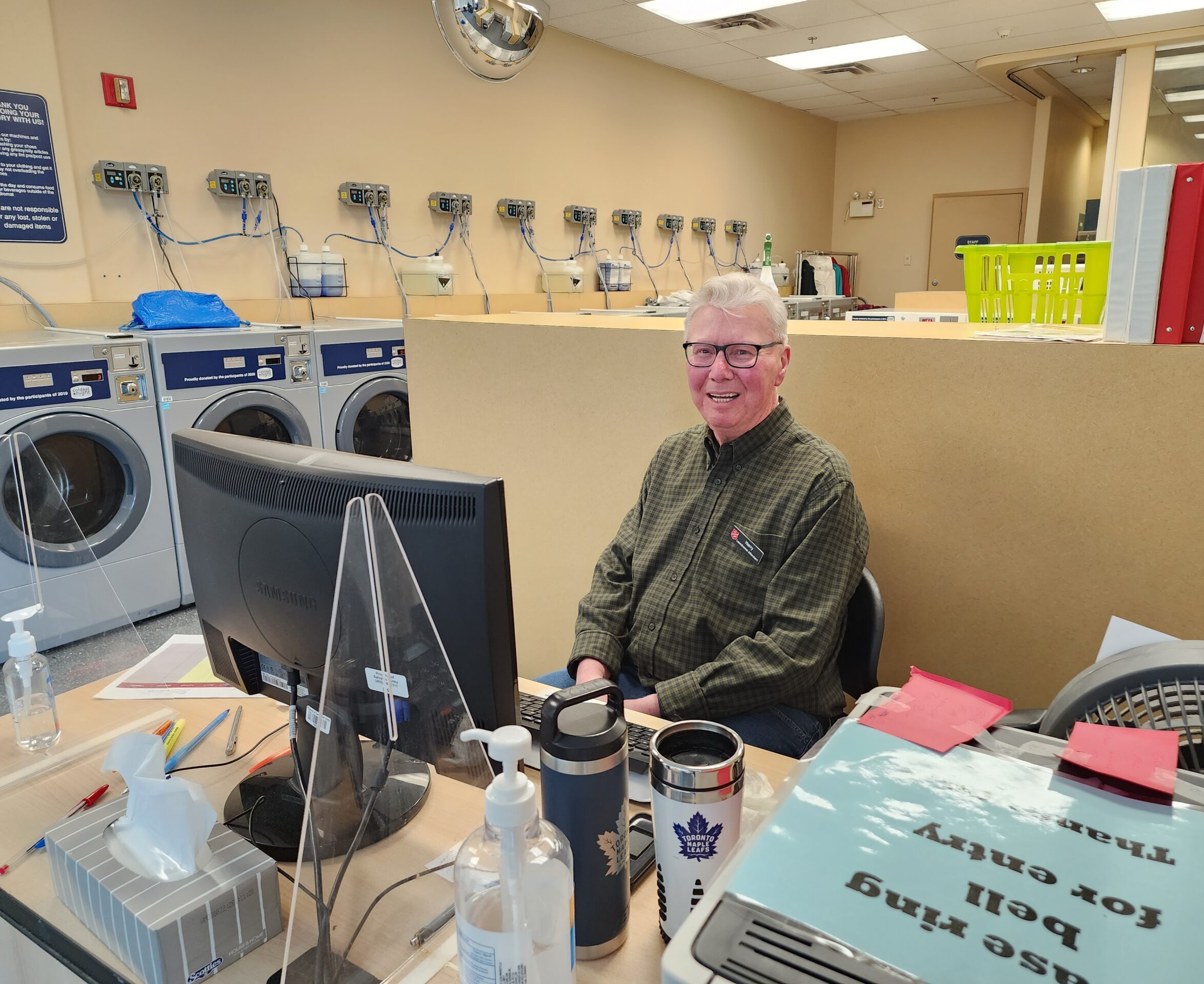 Harry at his desk at the Calgary Centre of Hope's laundromat