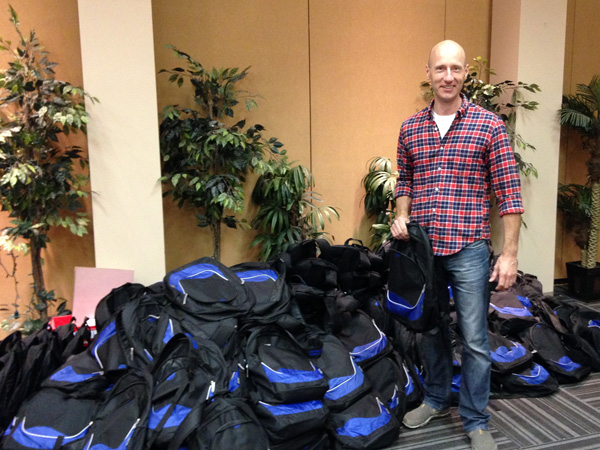Dr Bill Mulhall with filled backpacks