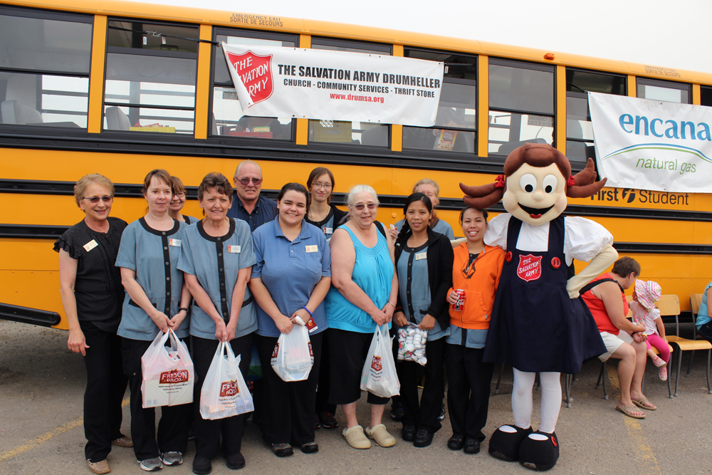 Super * stafff comes by to drop off food donations at Drumheller Salvation Army's 'Stuff-a-Bus' event.