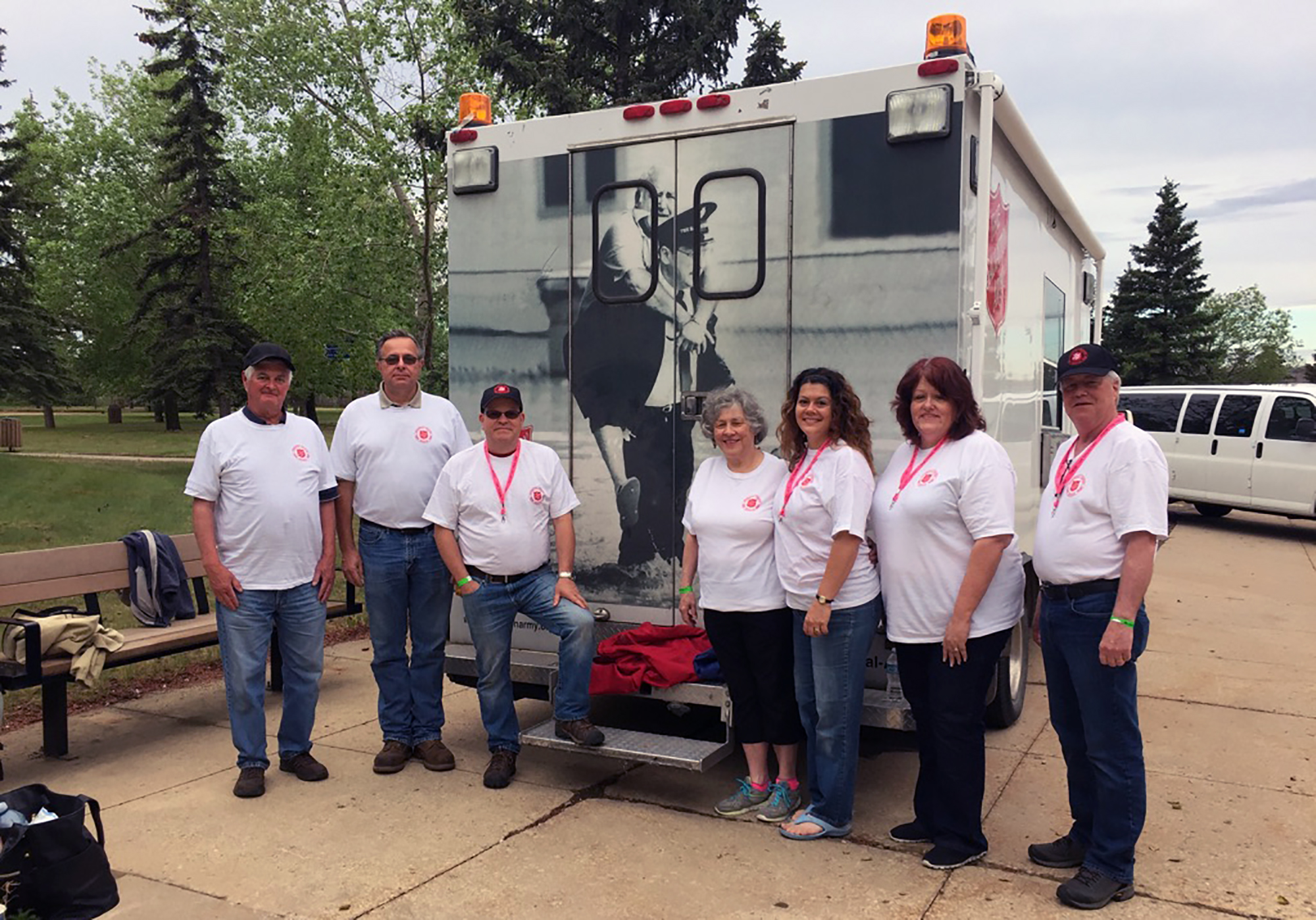 EDS workers posing in front of EDS van