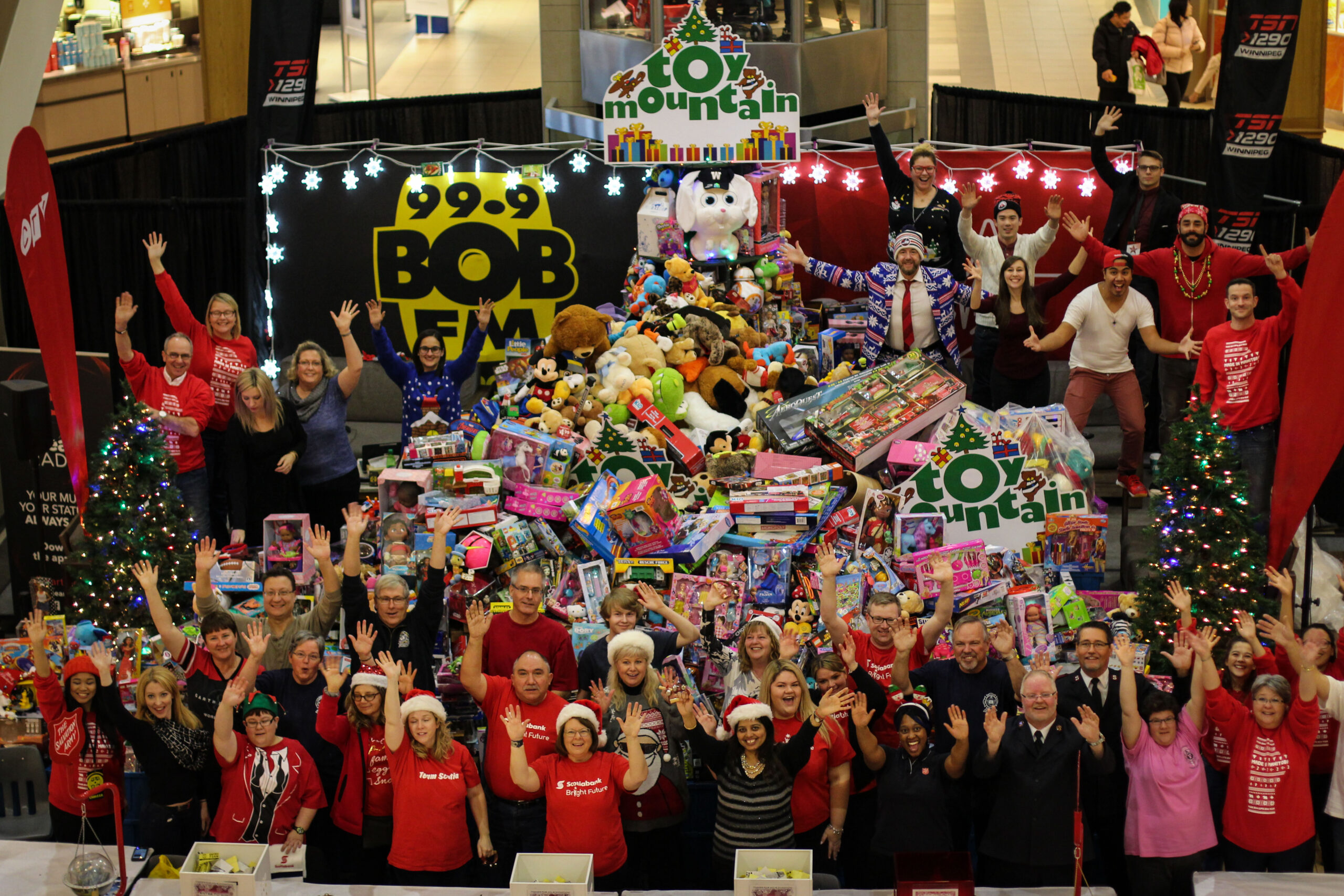 toy mountain team waving in front of toy mountain toys