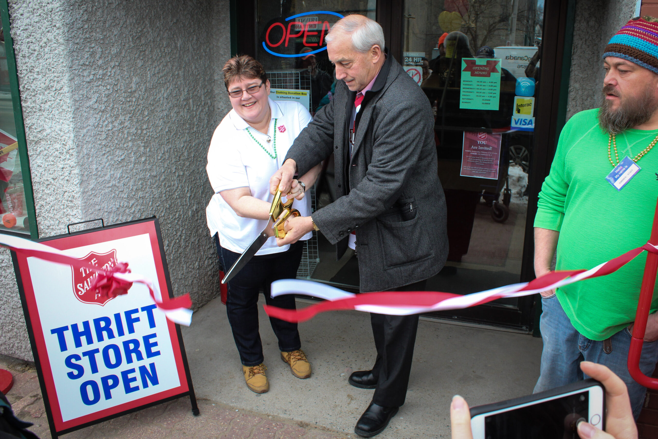 ribbon cutting at thrift store re-opening