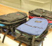 a pile of backpacks