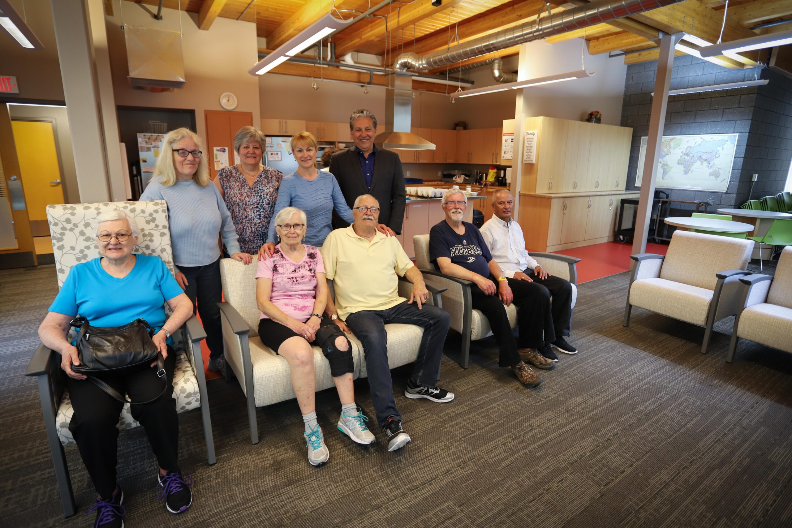 group posing on new furniture