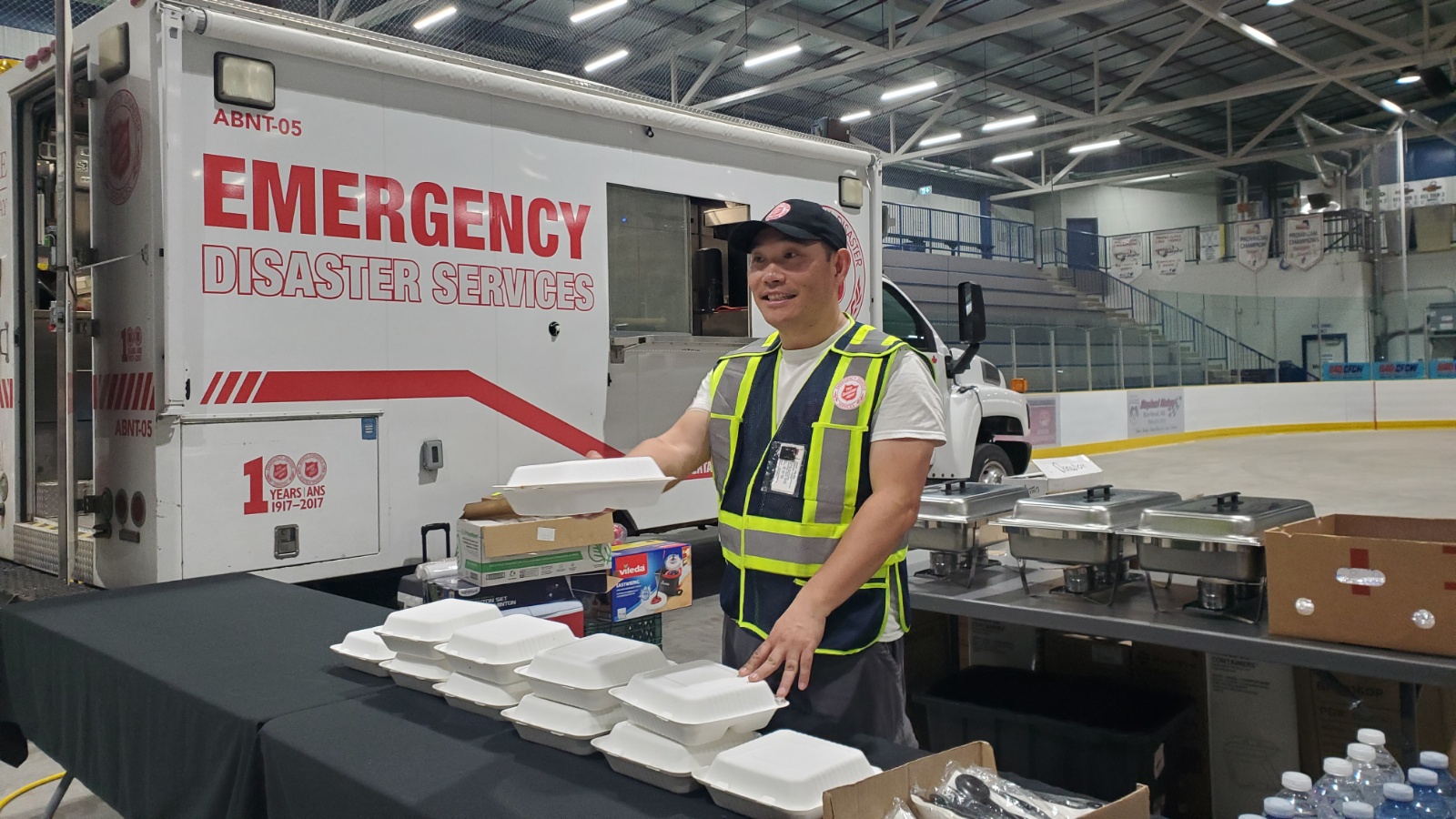 EDS member Peter serves food