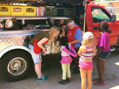 Leona Hayden finds joy handing out bagged lunches.