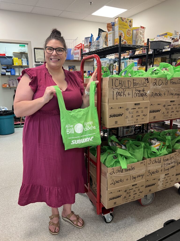 Woman holding a green bag