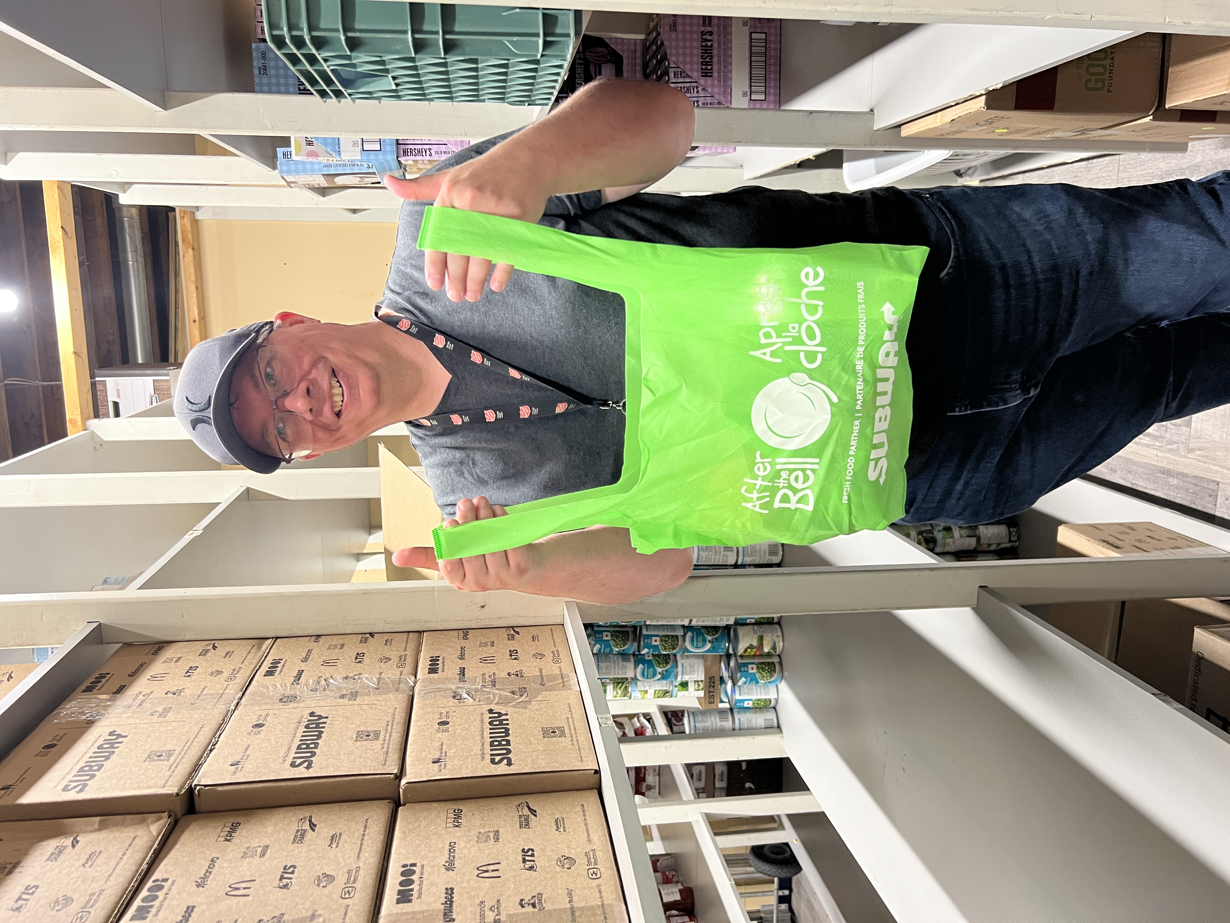 Man holding a green bag
