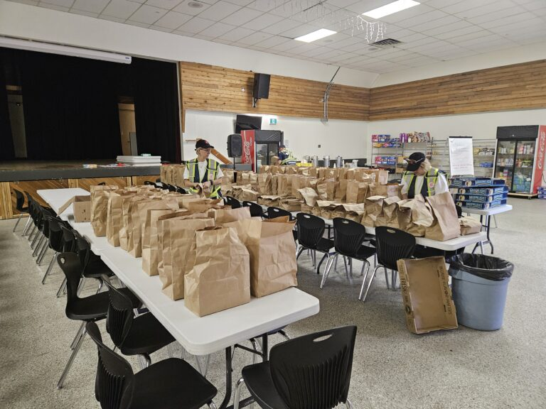 EDS Volunteers Annamaria (left) and Roxanne (right) prepares bagged lunches for first responders