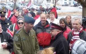 Captain Steve Manuel meets with CFB Trenton Base Commander Colonel David Cochrane. Quinte West Mayor, John Williams (far right) looks on.