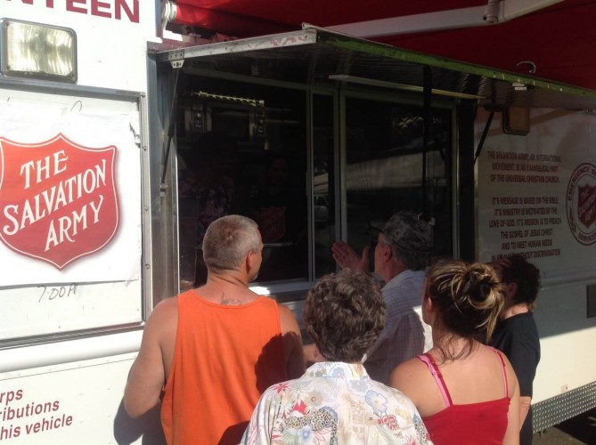 Salvation Army mobile feeding units provide food and hydration to displaced residents and first responders
