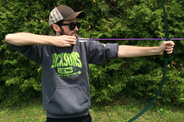 Camp counsellor, Chris, does archery