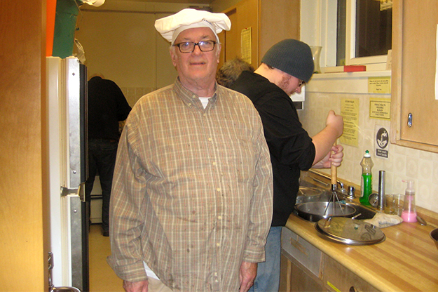 Lorne Moir, hands on in the kitchen, at his annual Christmas fundraising dinner