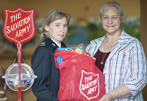 Salvation Army gives bag of food to client