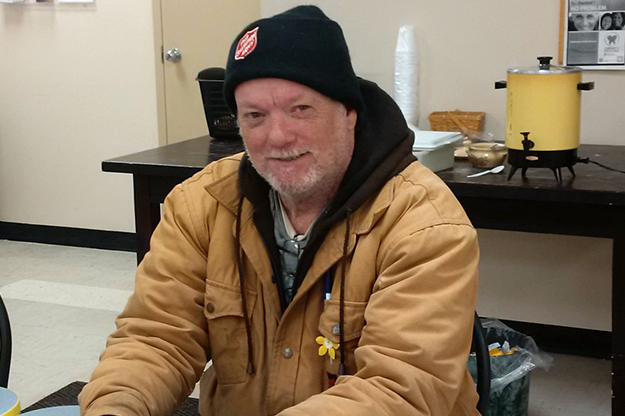 Volunteer with Salvation Army hat and winter coat