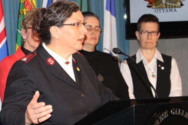 Major Shari Russell speaks at the ecumenical press conference on Parliament Hill on March 30, 2016