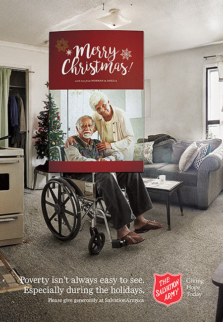 Salvation Army Canada Christmas 2016 campaign ad. Elderly couple framed in Christmas card. Beyond card frame you can see husband is in wheel chair and the apartment is in poor condition.
