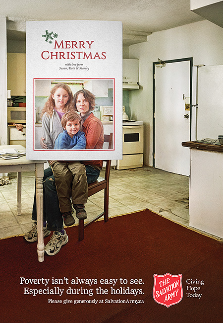 Salvation Army Canada Christmas 2016 campaign ad. Family framed in Christmas card. Beyond card frame you can see the kitchen is in poor condition.