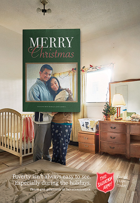 Salvation Army Canada Christmas 2016 campaign ad. Young couple with baby framed in Christmas card. Beyond card frame you can see they are standing in a bedroom which is in poor condition.