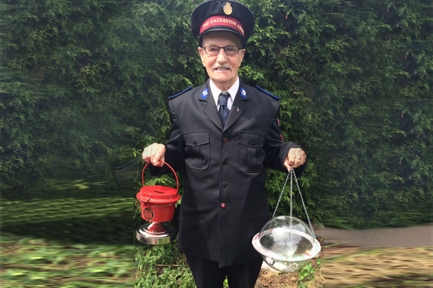 Bill Oliver holds Salvation Army kettles