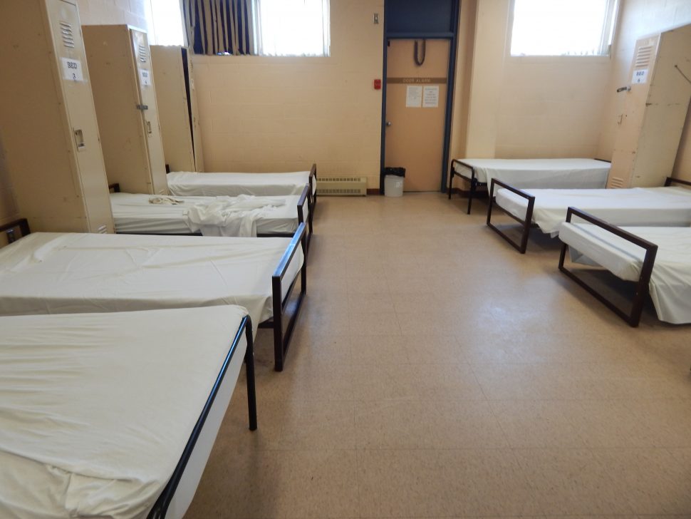 multiple beds inside of a Salvation Army shelter