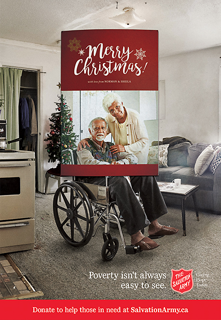 Salvation Army Canada Christmas 2017 campaign ad. Poverty isn't always easy to see. Donate to help those in need at salvation army dot c a. Elderly couple framed in Christmas card. Beyond card frame you can see husband is in wheel chair and the apartment is in poor condition.