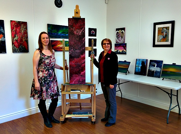 Denise Hynes (left) displays her art alongside Salvation Army worker, Jane Ash