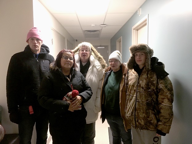 Jeromy, left, and a team from The Salvation Army fundraise to provide winter shelter