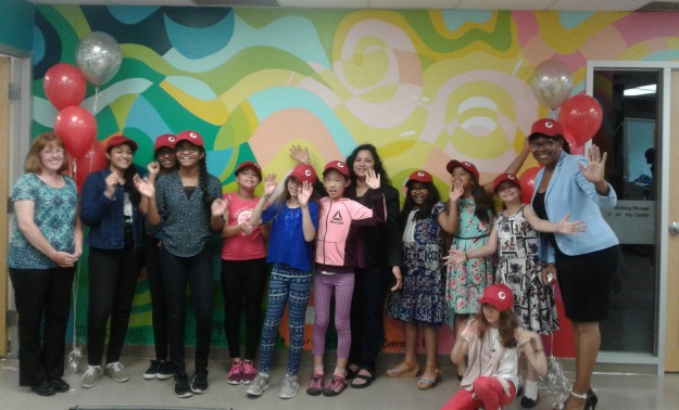 youth participants wear red caps at anger management program