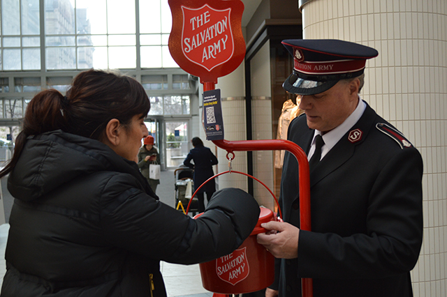 Woman Donates to Salvation Army Kettle