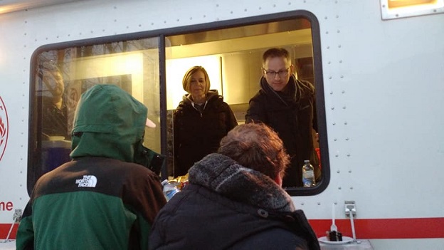 kitchen hand out hot food to people in downtown Halifax