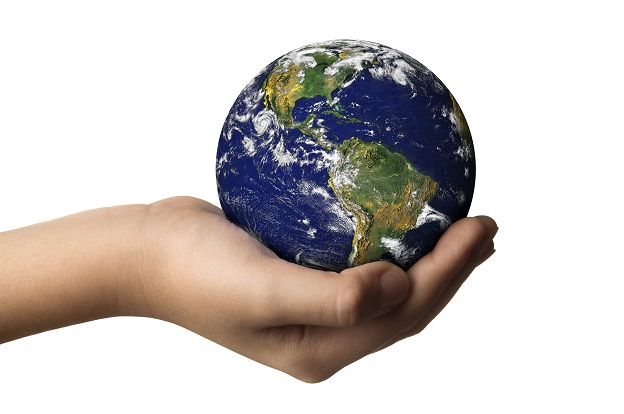 "A hand holding the earth,isolated on whiteEarth image: