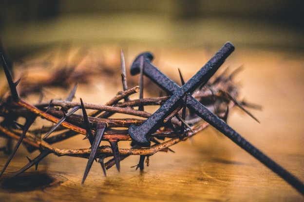 Crown of thorns under cross build of nails